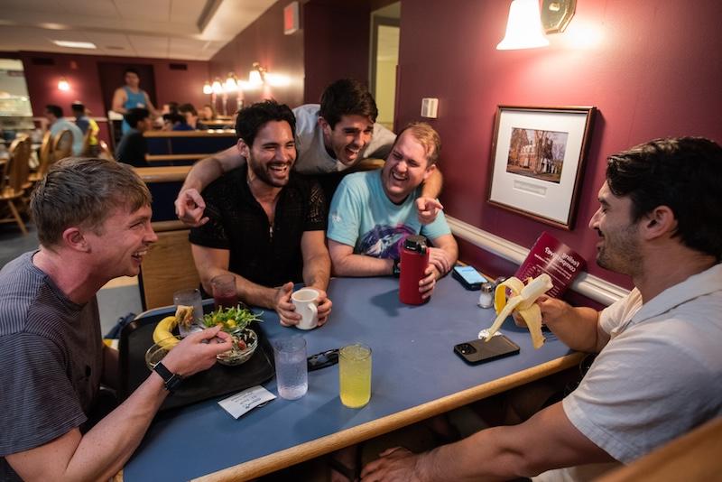 Group of people sitting in booth in Moulton Union Dining Hall